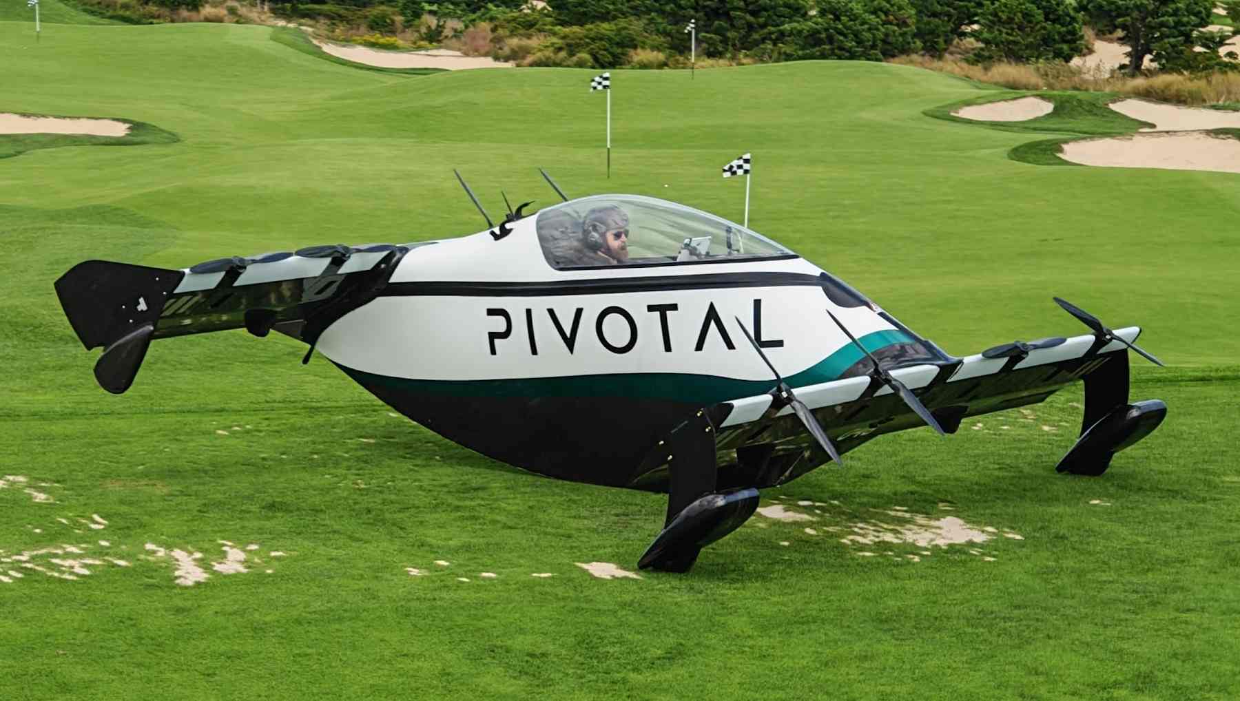 A Pivotal Helix Flying Car on a golf course ready to take off