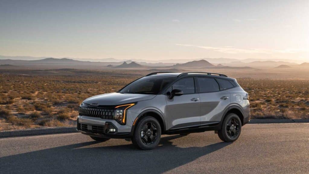A silver 2026 Kia Sportage on a road in the desert