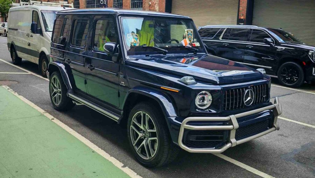 A Mercedes G-Wagen with an NYPD Decal in the window