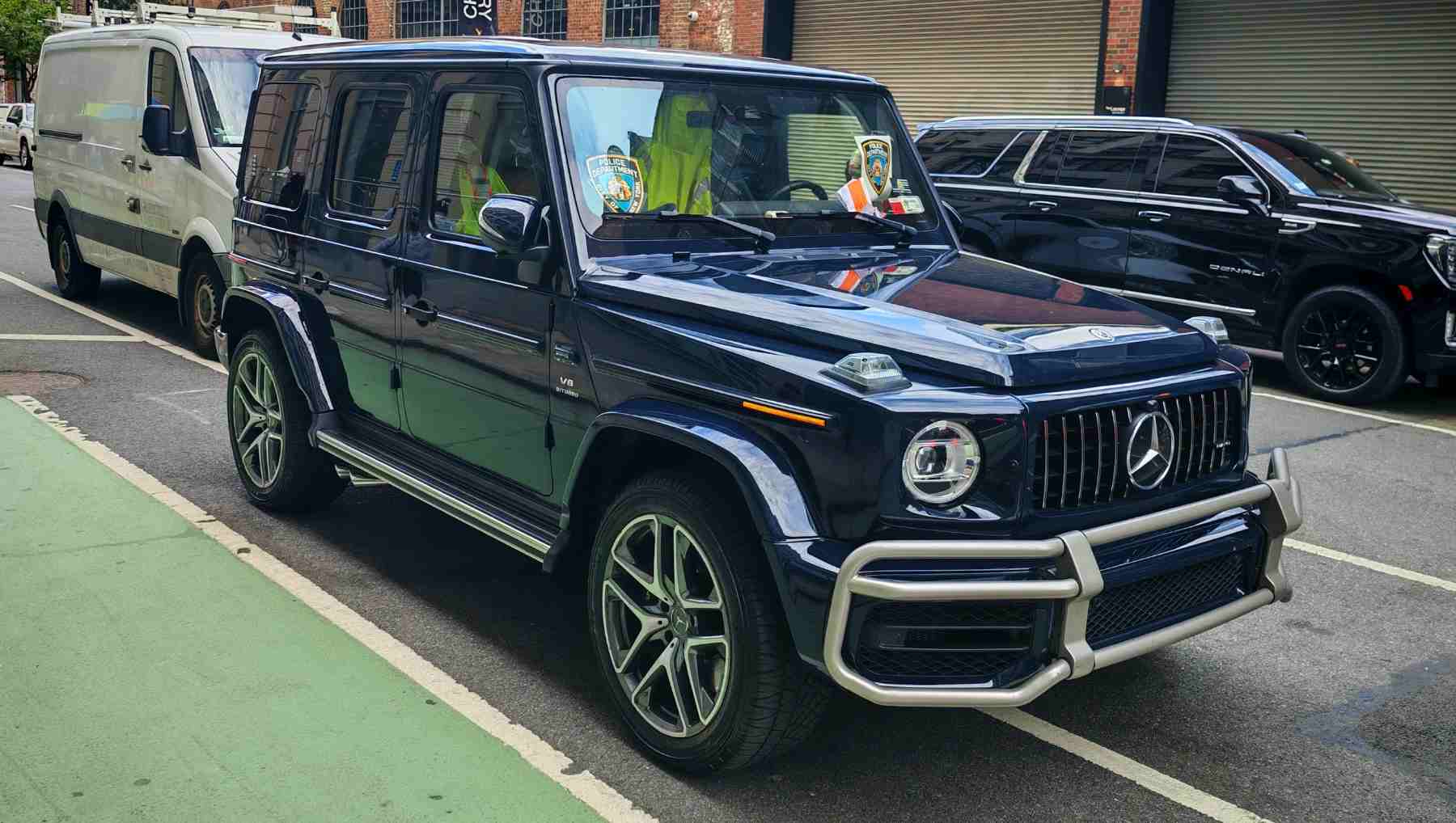 A Mercedes G-Wagen with an NYPD Decal in the window