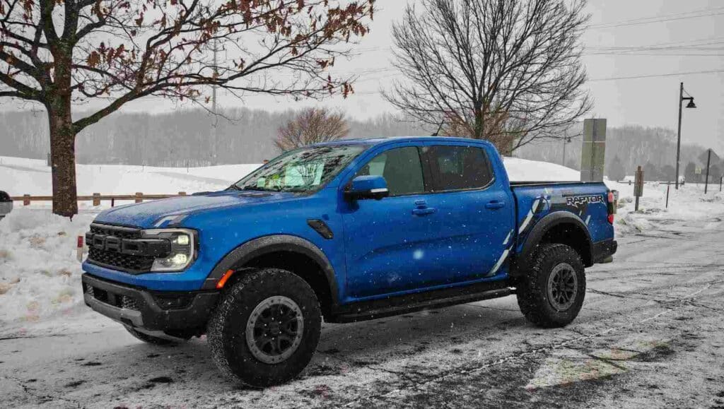 A blue Ford Ranger Raptor in the snow