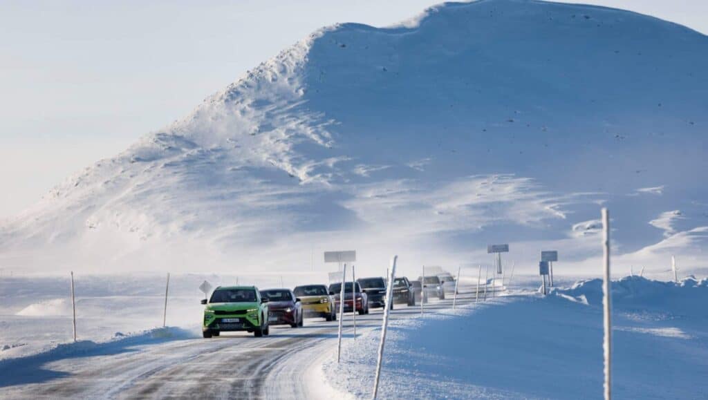 A line of EVs driving down an ice road