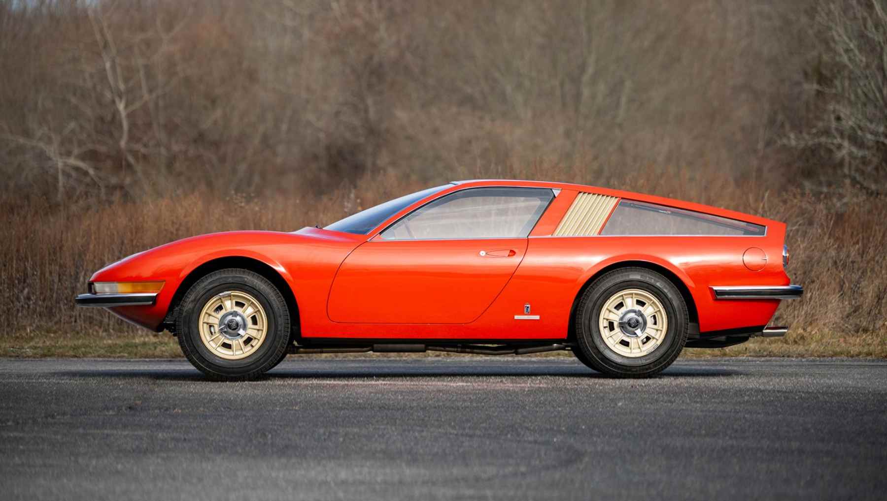 Side view of a red 1968 Fiat Dino Berlinetta Speciale