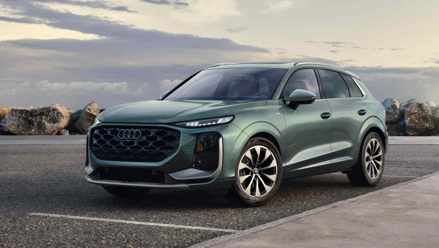 A green 2026 Audi Q3 from the front