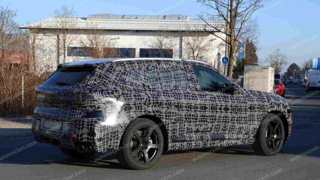 A shot of a camouflaged pre-production 2027 BMW X5