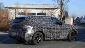 A shot of a camouflaged pre-production 2027 BMW X5