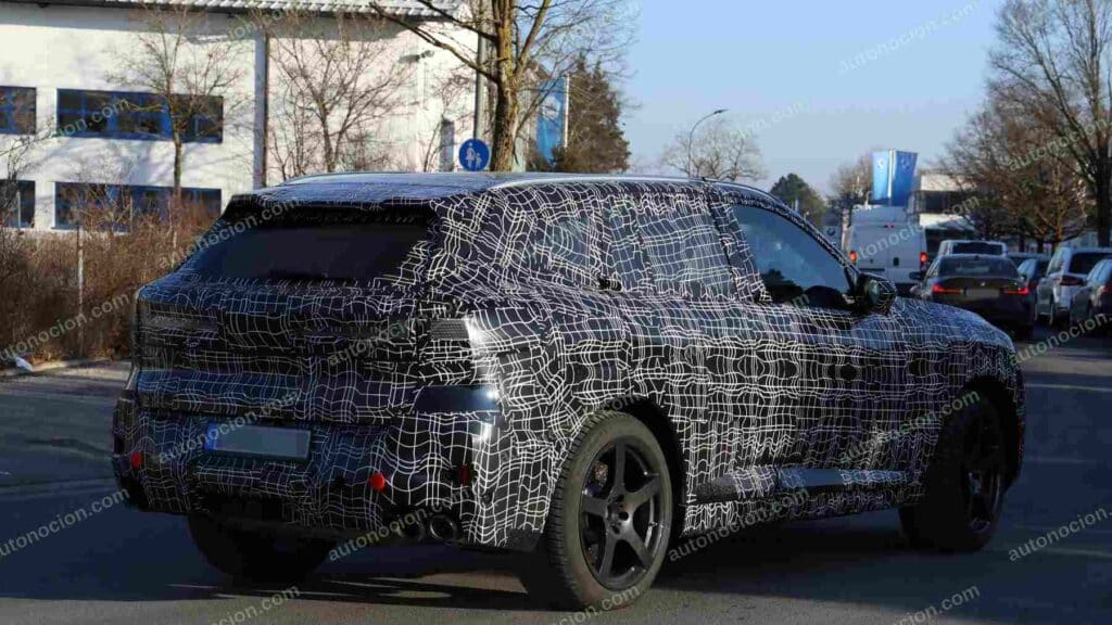 A shot of a camouflaged pre-production 2027 BMW X5