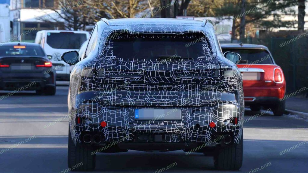 A shot of a camouflaged pre-production 2027 BMW X5