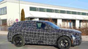 A shot of a camouflaged pre-production 2027 BMW X5