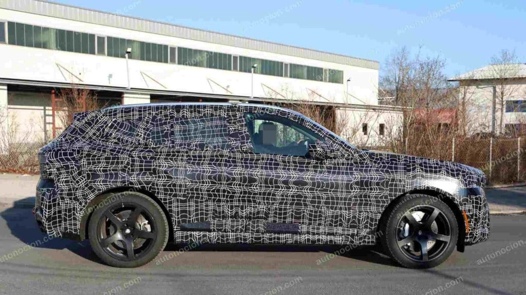 A shot of a camouflaged pre-production 2027 BMW X5