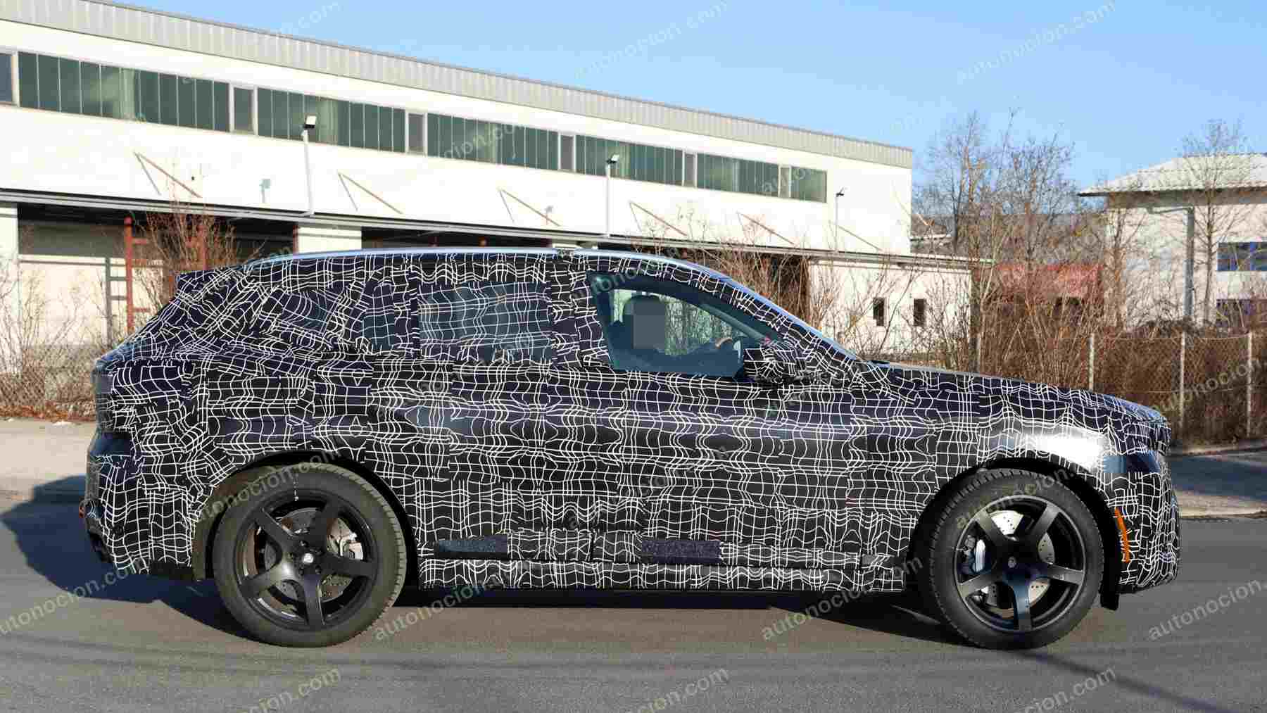 A shot of a camouflaged pre-production 2027 BMW X5