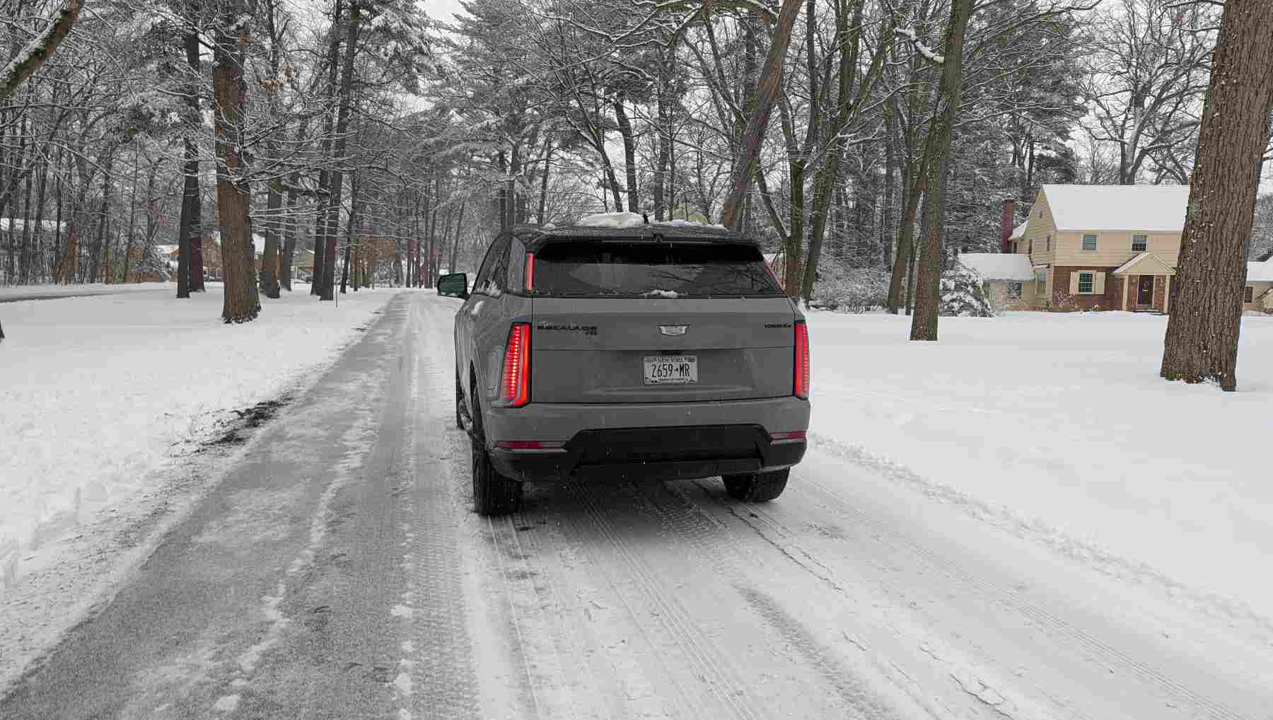 Rear shot of a Cadillac Escalade IQ in snow