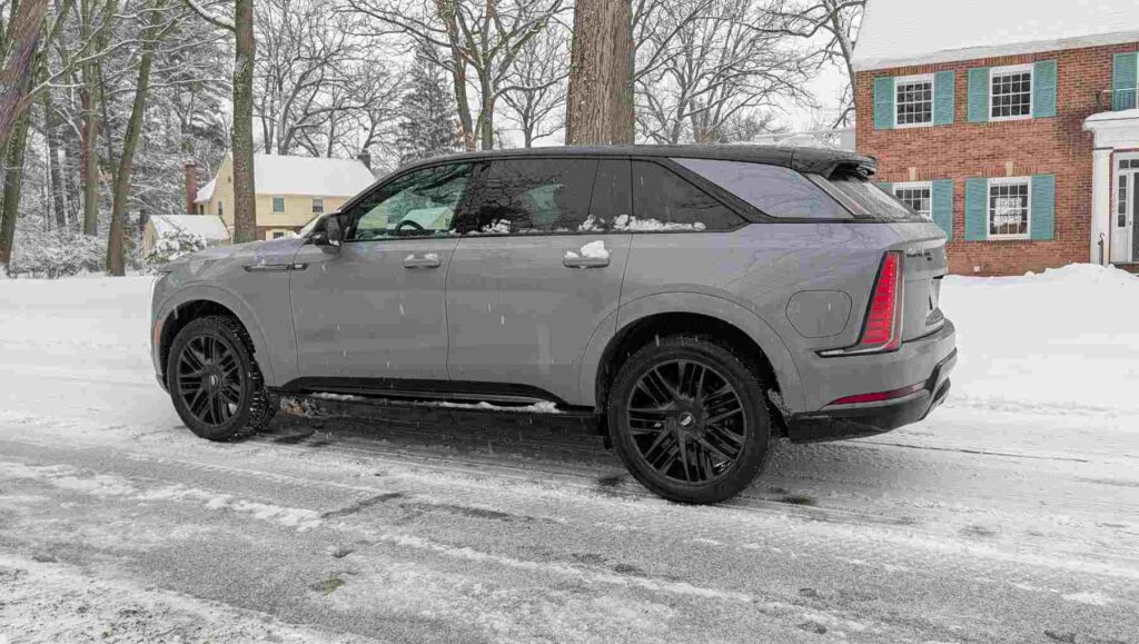 Side view of a Cadillac Escalade IQ in snow