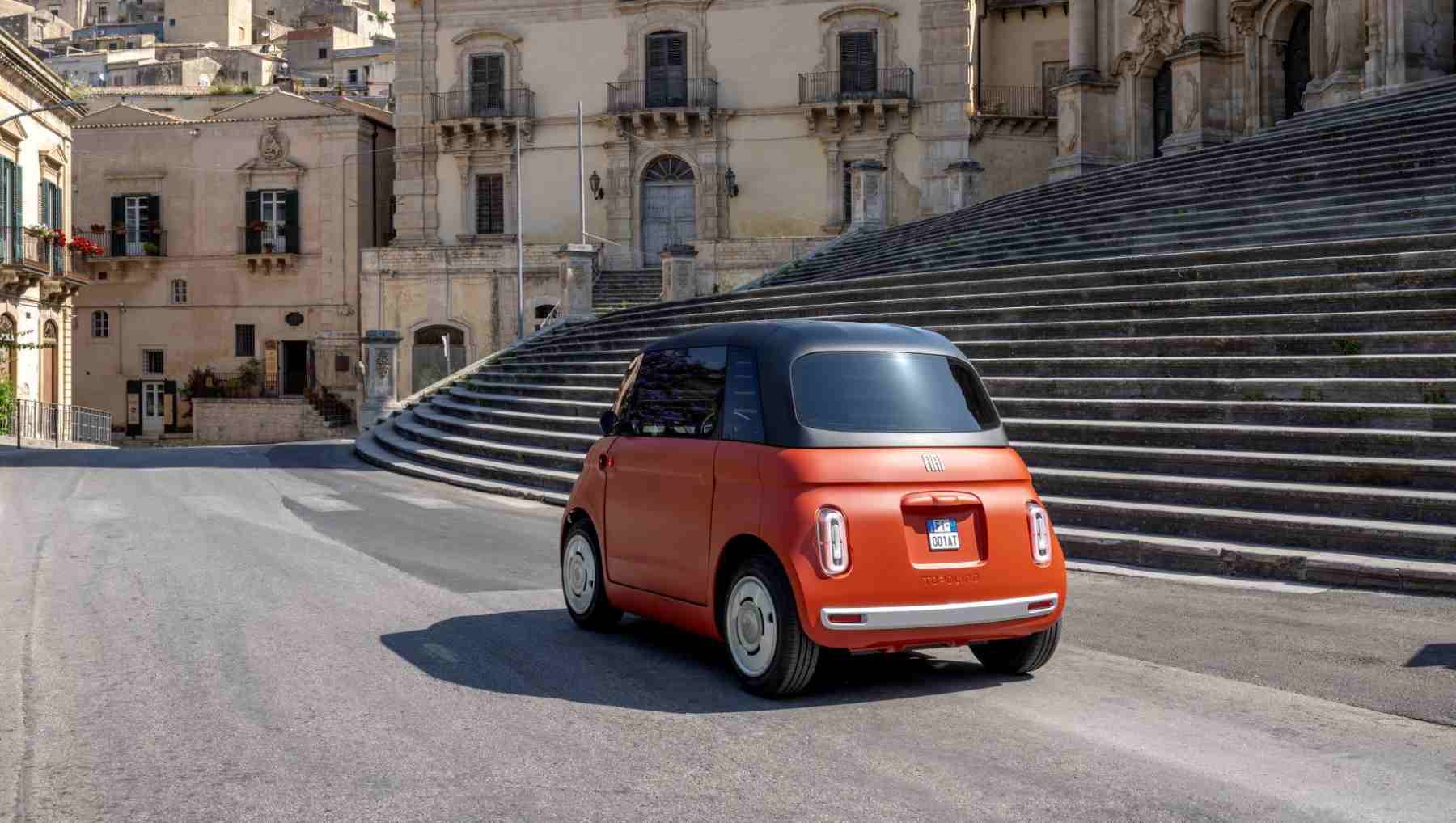 Rear 3/4 view of a red Fiat Topolino