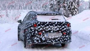 Spy shots of a camouflaged 2027 Mercedes-AMG GT SUV EV in a winter setting