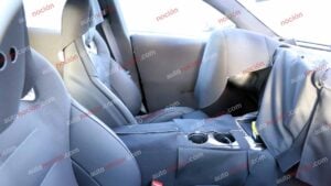 Spy shots of the interior of a 2027 Mercedes-AMG GT SUV EV in a winter setting