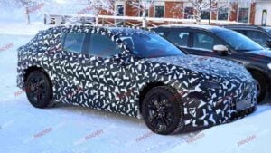 Spy shots of a camouflaged 2027 Mercedes-AMG GT SUV EV in a winter setting