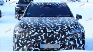 Spy shots of a camouflaged 2027 Mercedes-AMG GT SUV EV in a winter setting