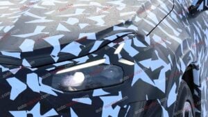 Spy shots of a camouflaged 2027 Mercedes-AMG GT SUV EV in a winter setting