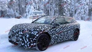 Spy shots of a camouflaged 2027 Mercedes-AMG GT SUV EV in a winter setting