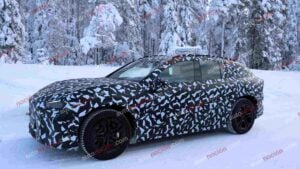 Spy shots of a camouflaged 2027 Mercedes-AMG GT SUV EV in a winter setting