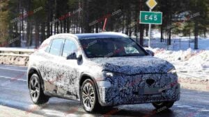 A spy shot of a camouflaged Mercedes-Benz GLA EQ in winter conditiona