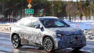 A spy shot of a camouflaged Mercedes-Benz GLA EQ in winter conditiona