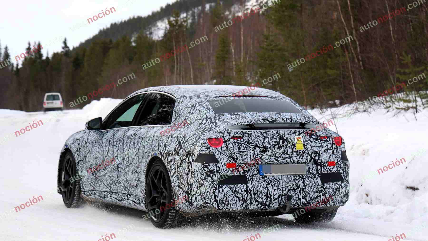 A camouflaged prototype of the upcoming Mercedes-AMG electric C-Class