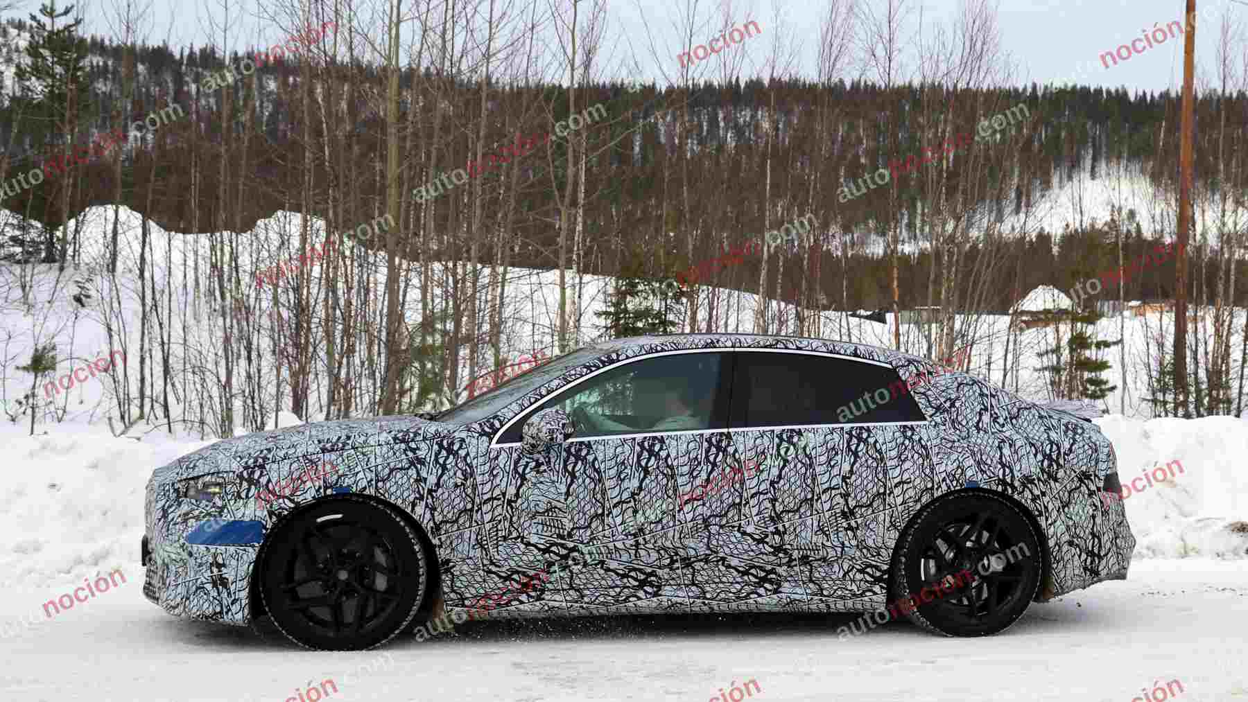 A camouflaged prototype of the upcoming Mercedes-AMG electric C-Class