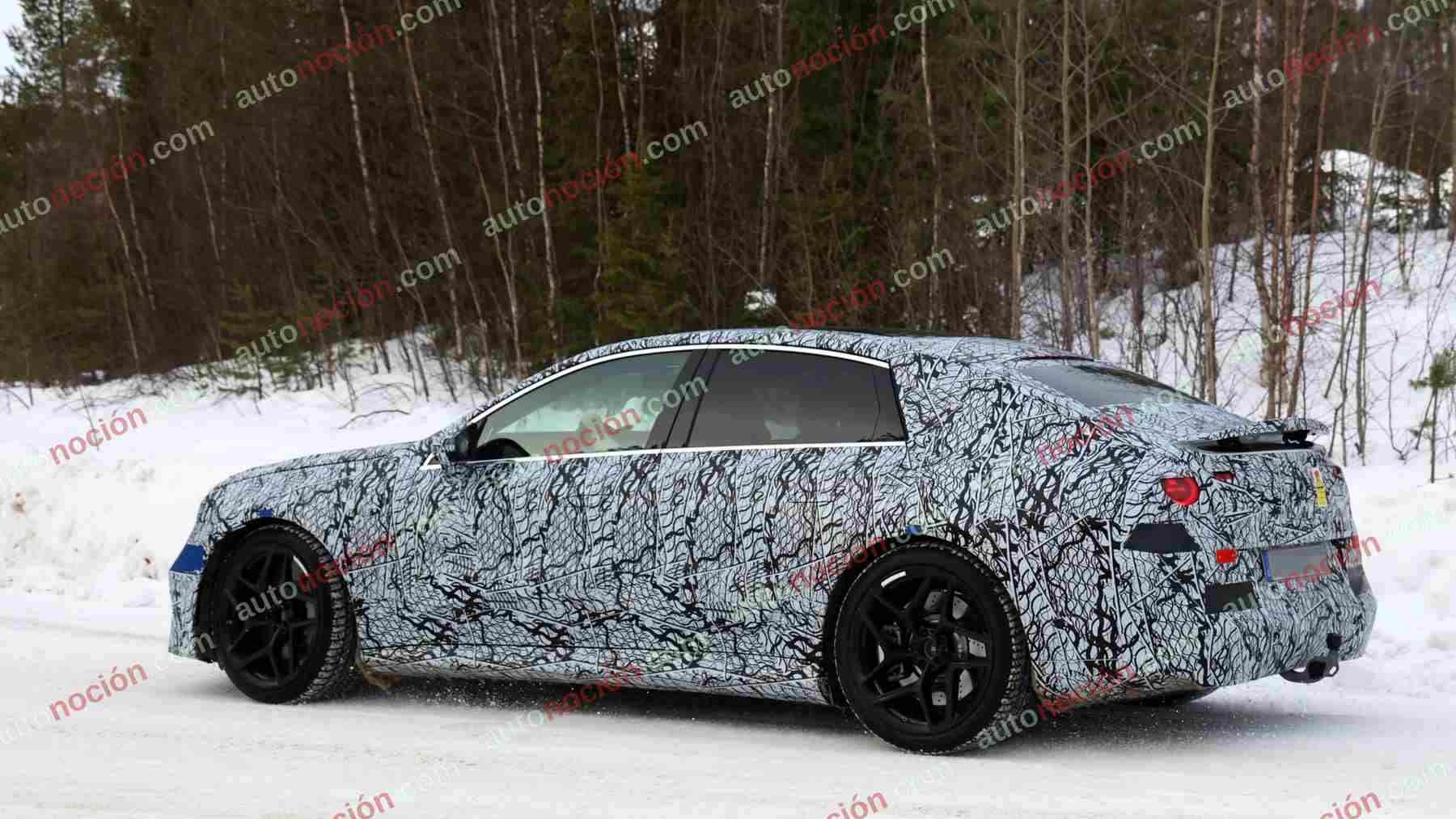 A camouflaged prototype of the upcoming Mercedes-AMG electric C-Class