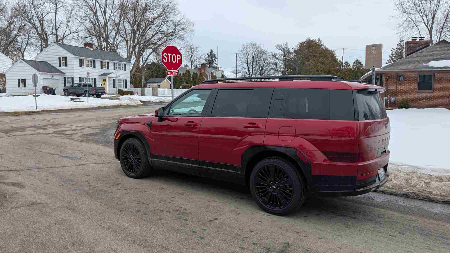 Side vire of a red 2026 a Hyundai Santa Fe
