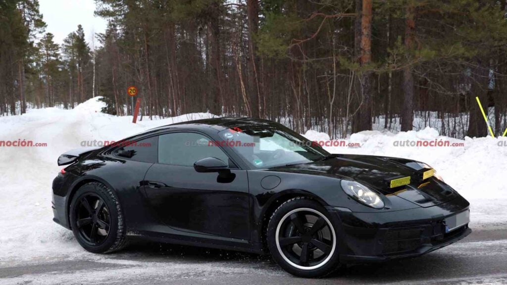 Side Spy shot of the upcoming 2027 Porsche Dakar testing in a snowy environment