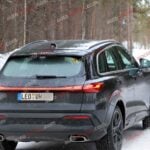 A black Audi Q5 being used as a Porsche Macan mule for winter testing