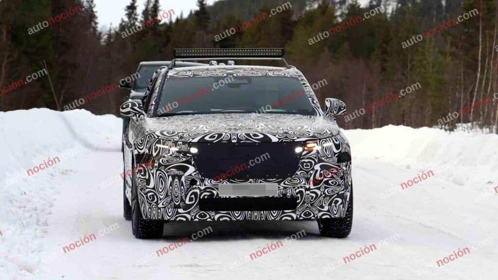 Spy shot of the 2027 Range Rover Velar Front covered in camouflage.