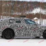 Spy shot of the 2027 Range Rover Velar side covered in camouflage.