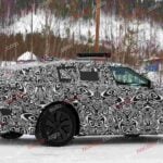 Spy shot of the 2027 Range Rover Velar side covered in camouflage.