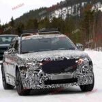 Spy shot of the 2027 Range Rover Velar Front covered in camouflage.