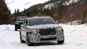 Spy shot of the 2027 Range Rover Velar Front covered in camouflage.