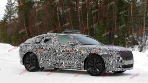 Spy shot of the 2027 Range Rover Velar side covered in camouflage.
