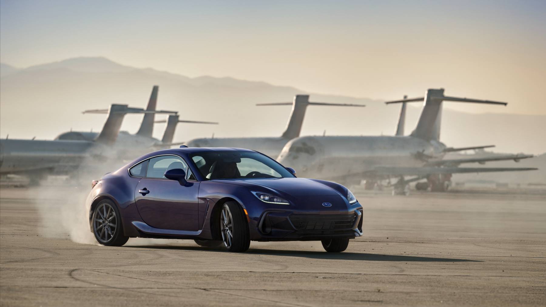 A 2025 Subaru BRZ driving on a desert airstrip