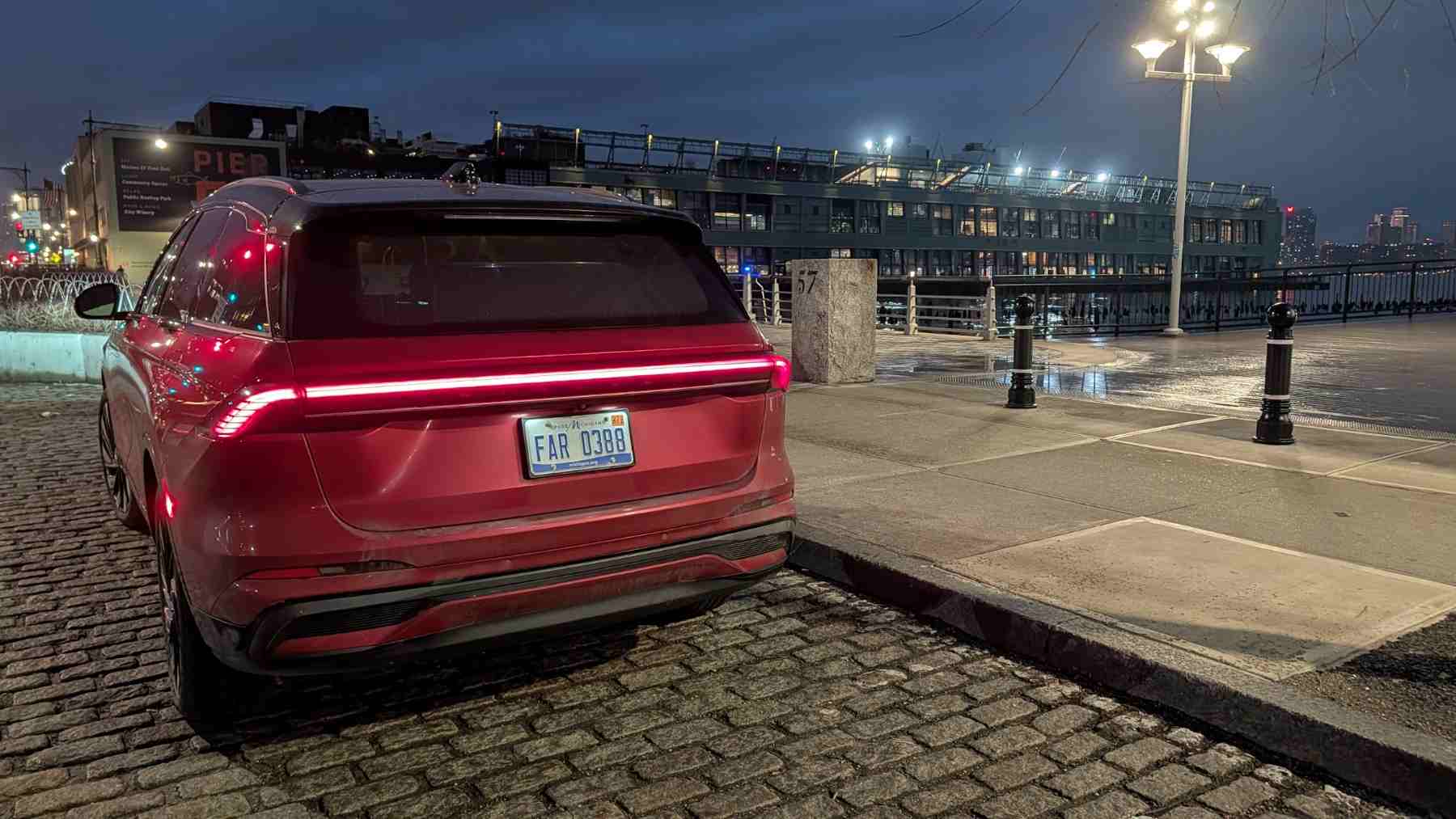 Rear 3/4 view of a red 2027 Lincoln Nautilus on Pier 60