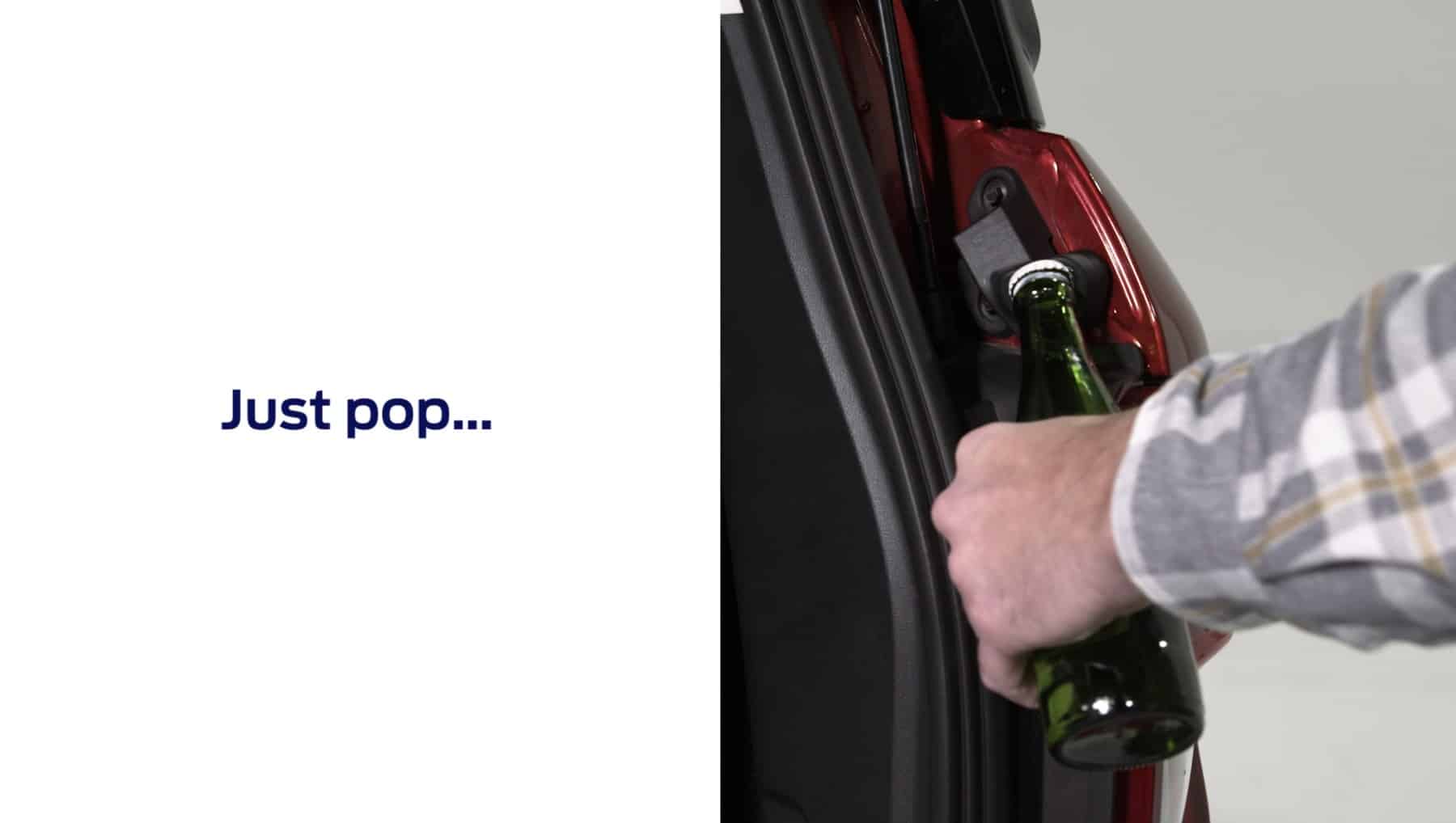 The bottle opener in a Bronco Ford being used