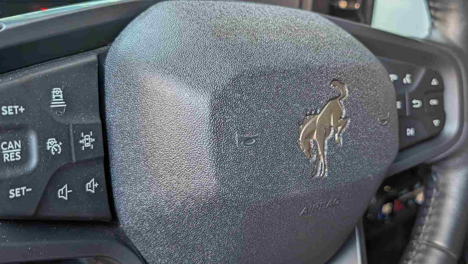 Filson brass coated Ford Bronco logo on the steering wheel of the The Ford Bronco x Filson Wildland Fire Rig concept