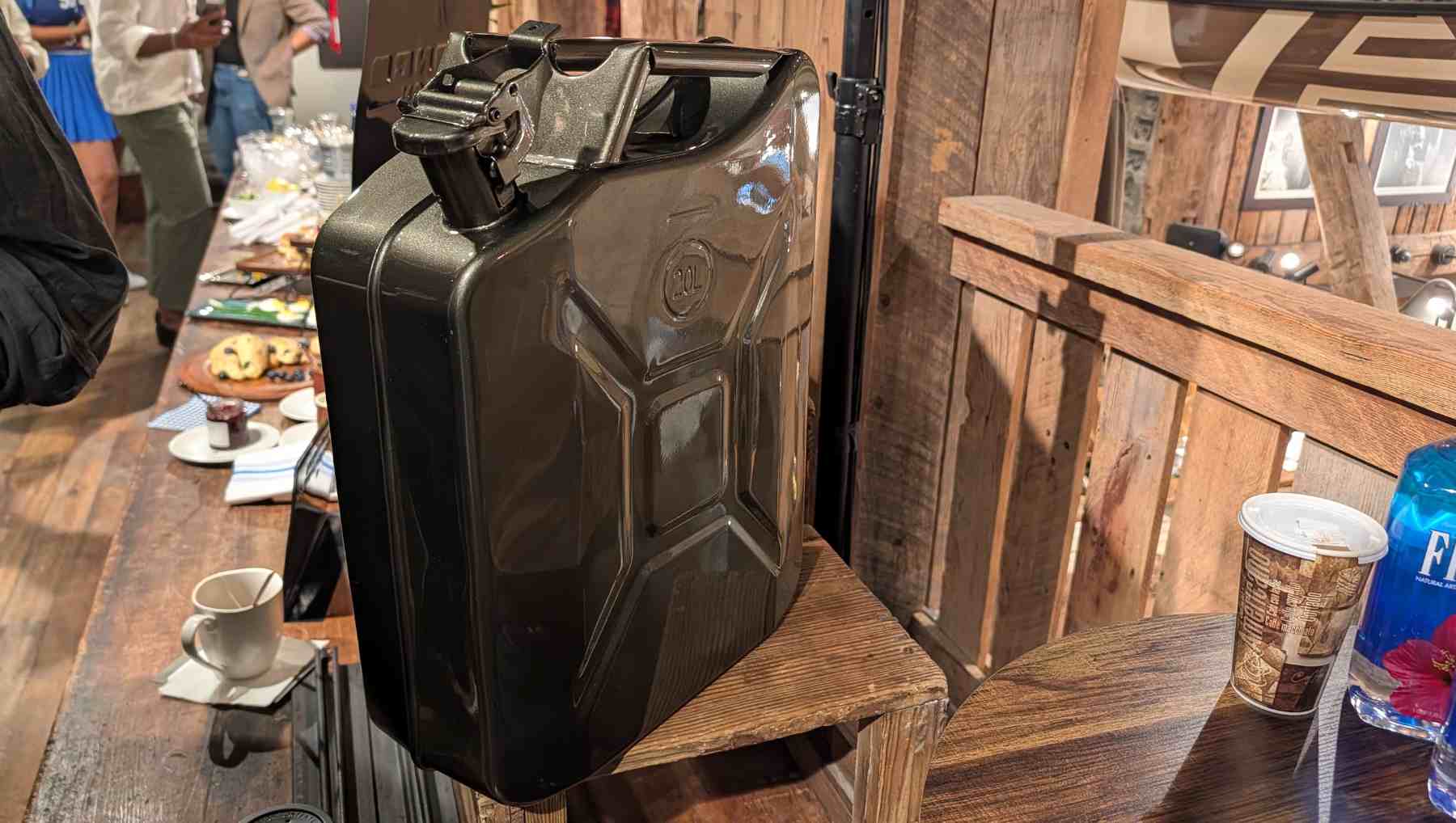 A green Jerry Can at the end of a buffet table