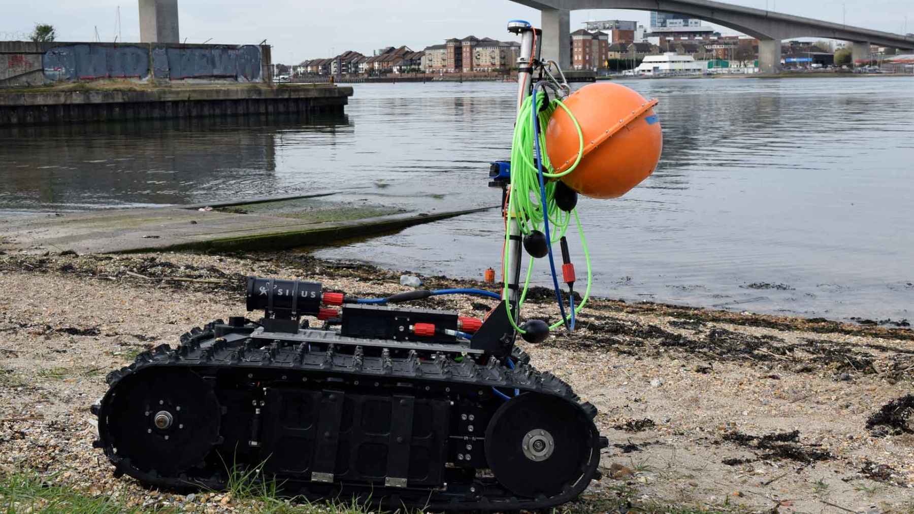 An American drone crawls out of the deep on tank tracks, drives across the seabed and pushes through six feet of breaking surf to climb onto the beach, hunting the mines in the one strip of coast every swimming drone has to turn around at
