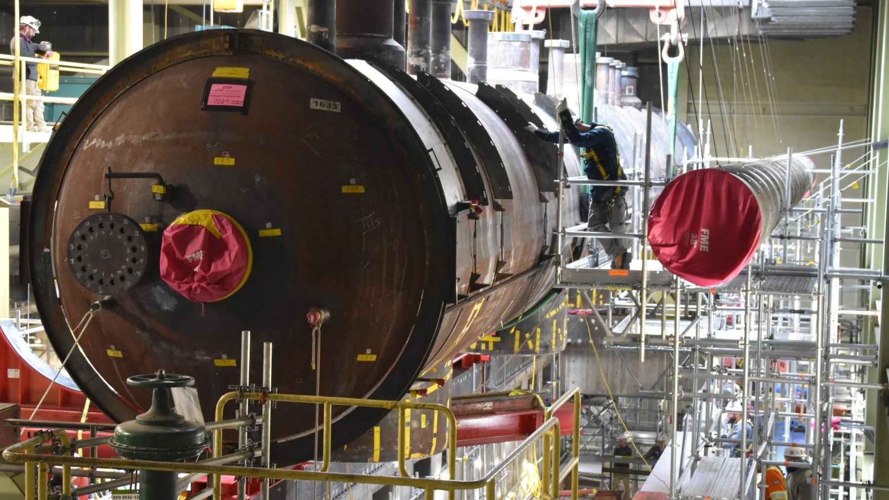 Canada just cut a hole in the roof of a working nuclear reactor, hauled out eight steam generators weighing 100 tons each, and lowered new ones into the same hole, bringing the reactor back online seven months early to run another 35 years