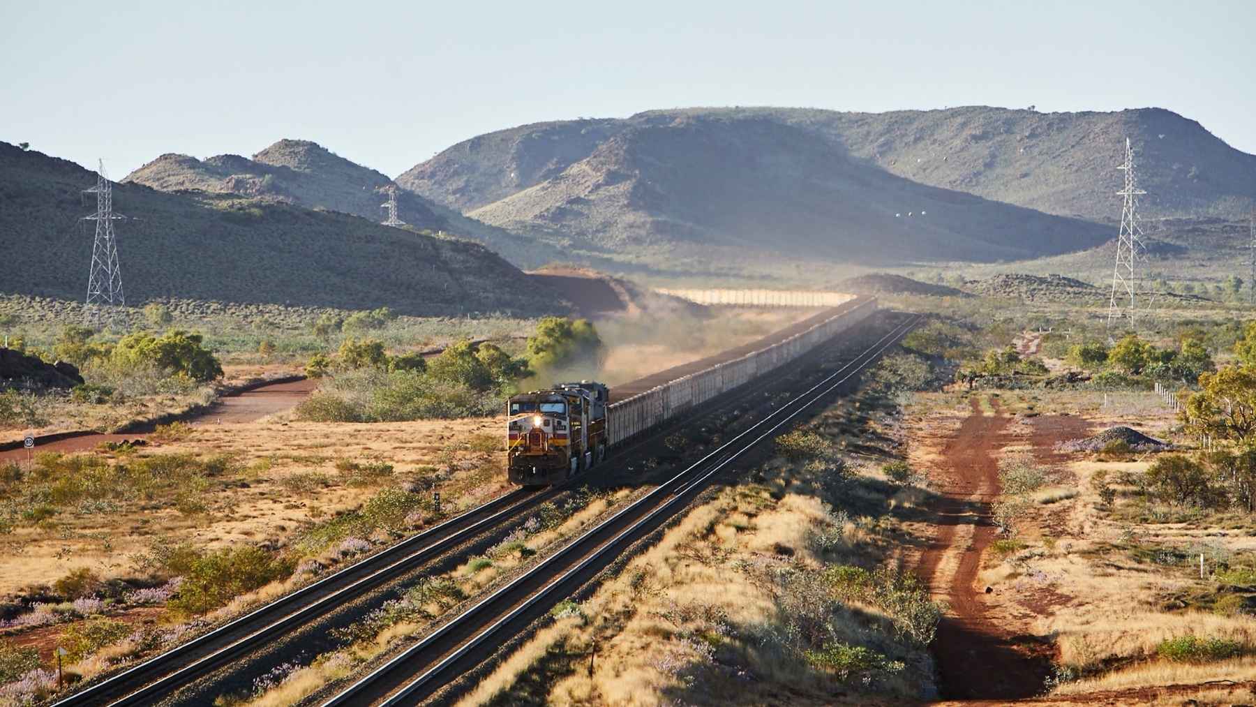 Australia quietly automated its desert freight years ago, running 53 driverless trains at once that haul 28,000 tons of ore a trip from a control room 930 miles away, while the U.S. only just approved its first stretch of true high-speed track