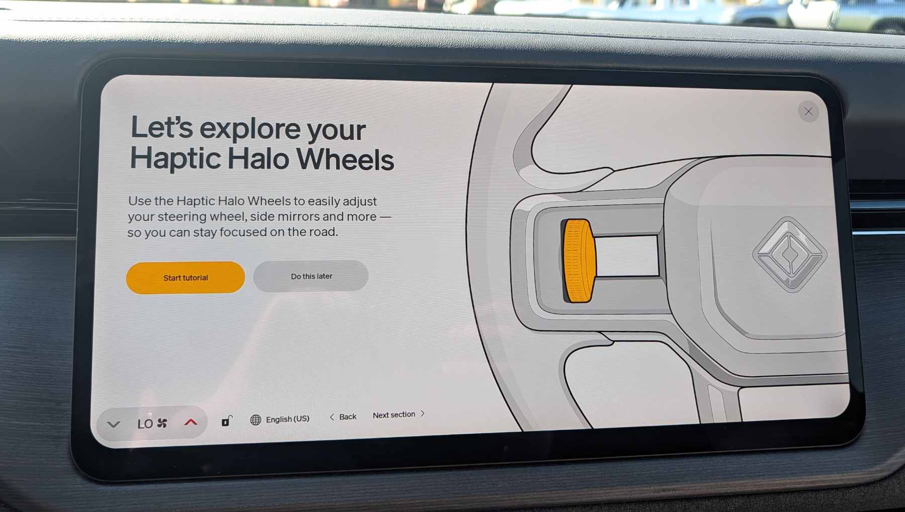 Instructions on using the Rivian R2 Haptic Halo dial appearing on the vehicle touch screen