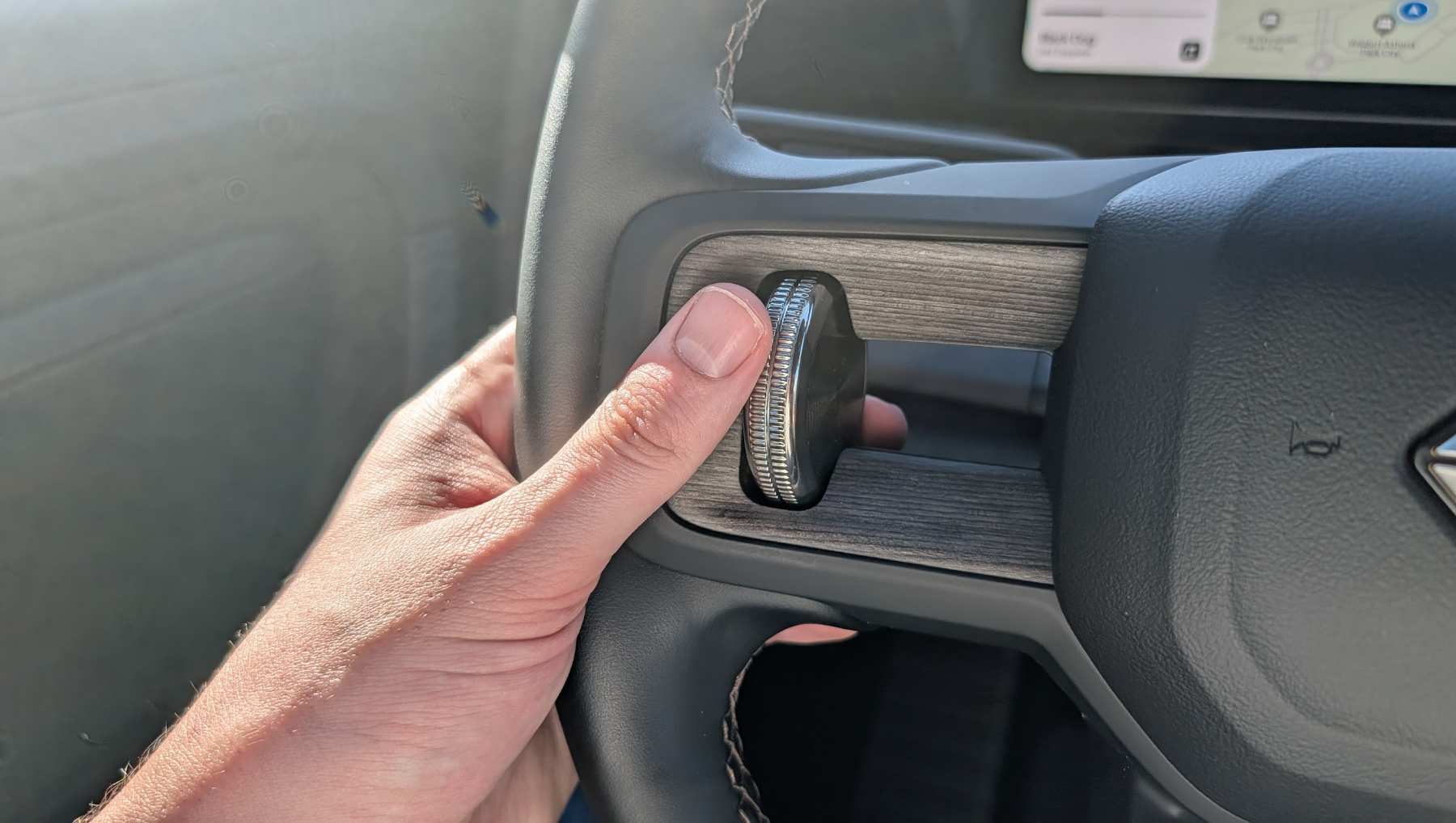 The left Rivian R2 Haptic Halo dial