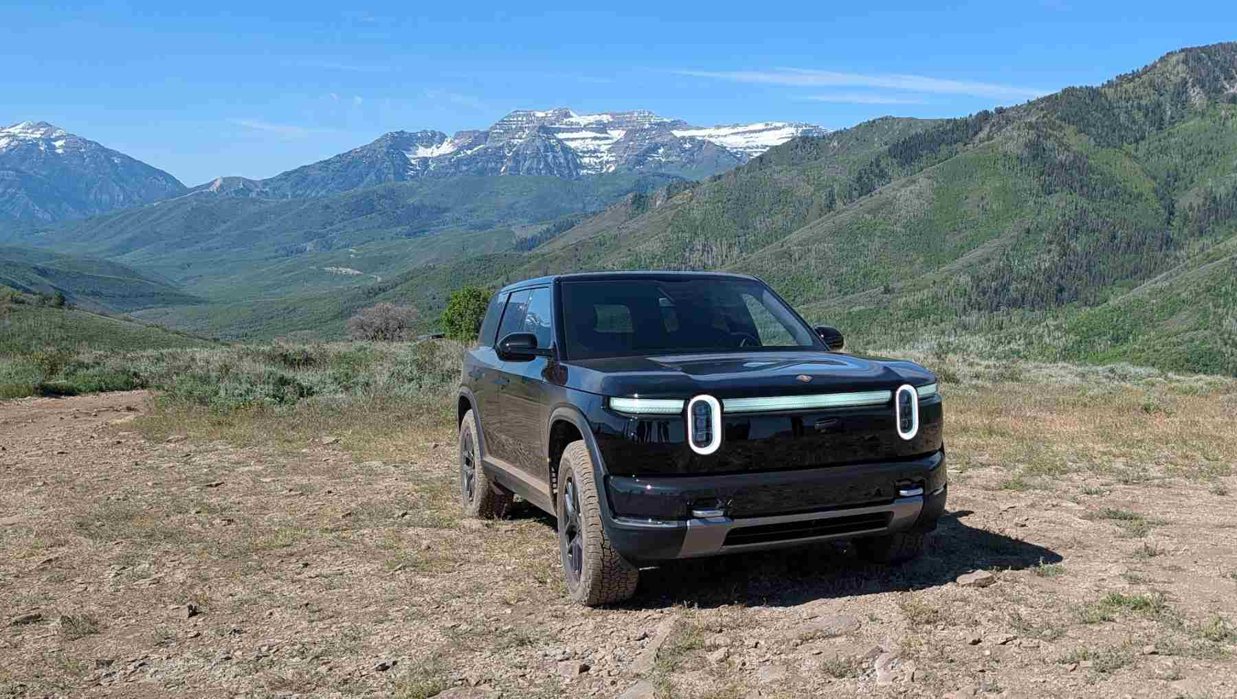 Front view of A Rivian R2 on a mountain top